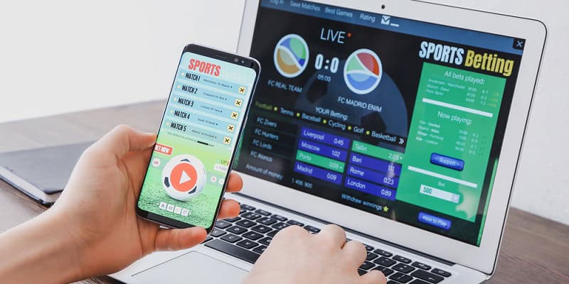 Man placing sports bet at home